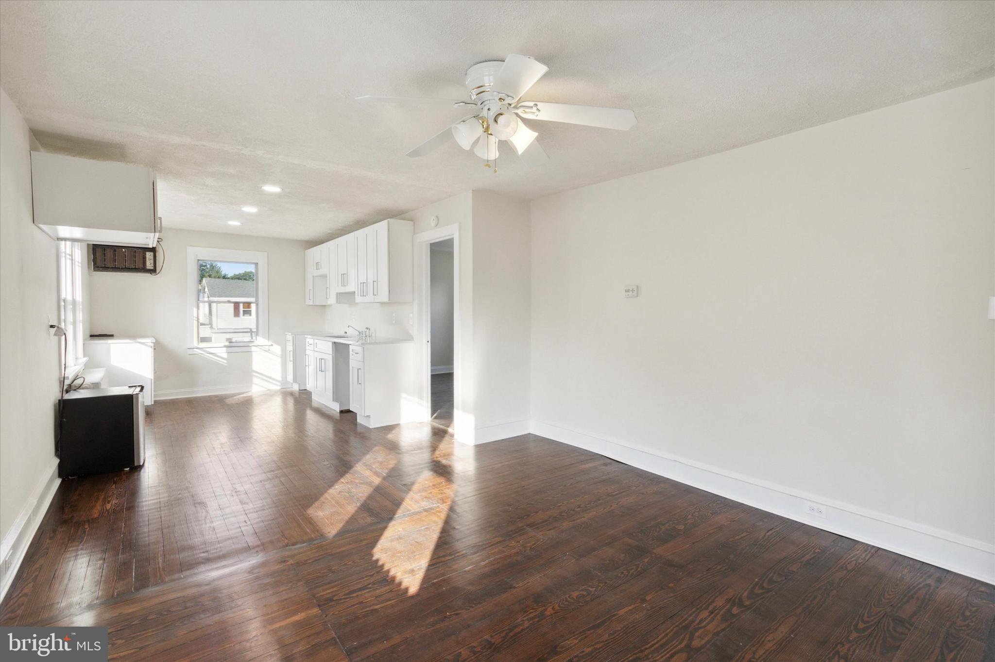 417 Garfield Avenue, Unit 2 Folcroft, PA 19032 - Photo 1 of 14 a view of a living room with hardwood floor and a ceiling fan