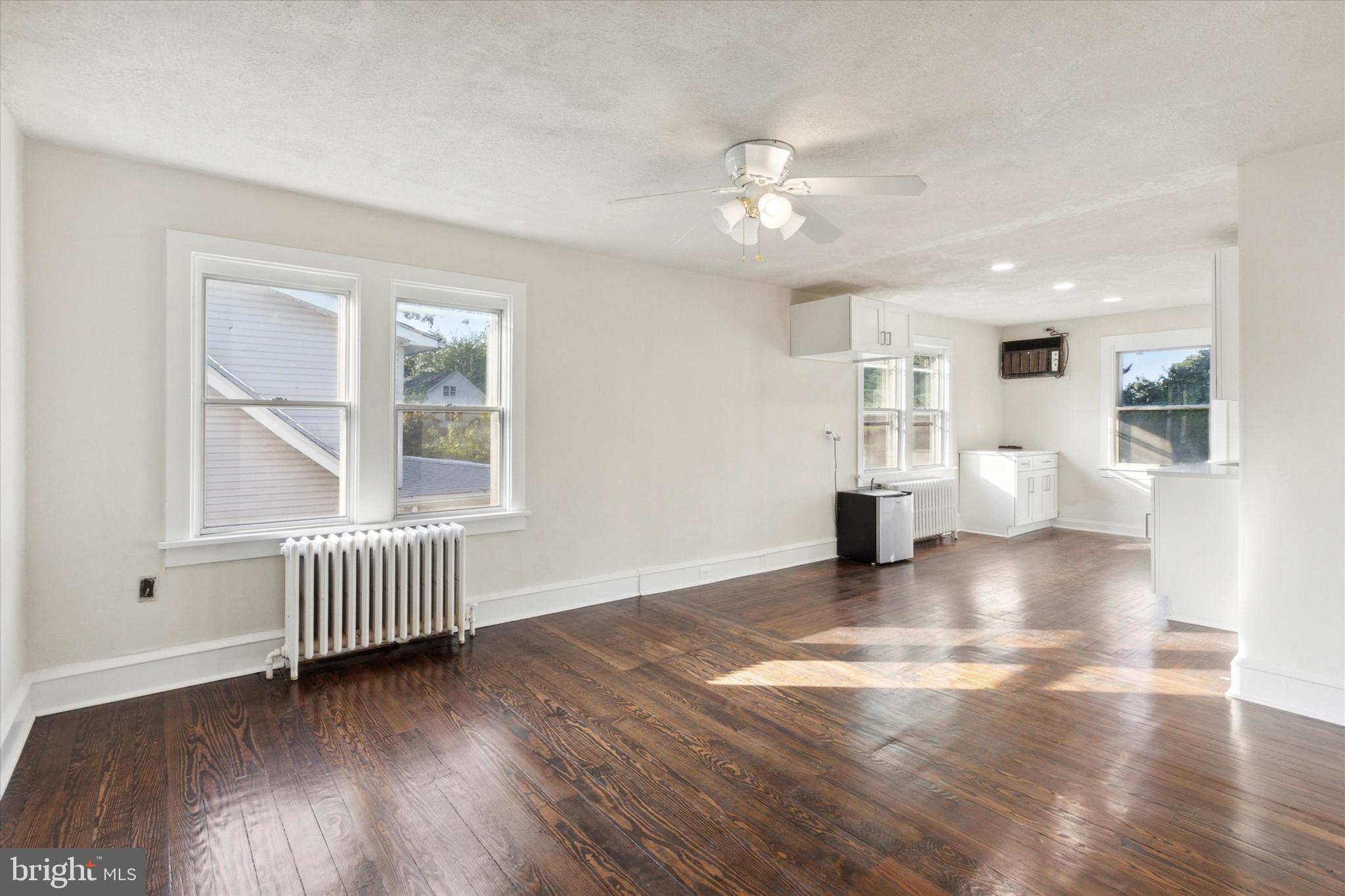 417 Garfield Avenue, Unit 2 Folcroft, PA 19032 - Photo 7 of 14 a view of an empty room with wooden floor and a window