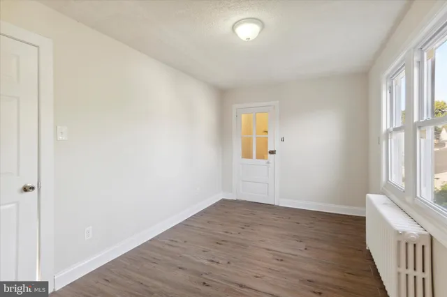 a bathroom with a toilet sink and shower