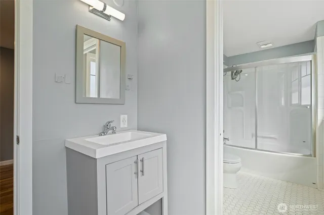 a bathroom with a sink a vanity and a mirror
