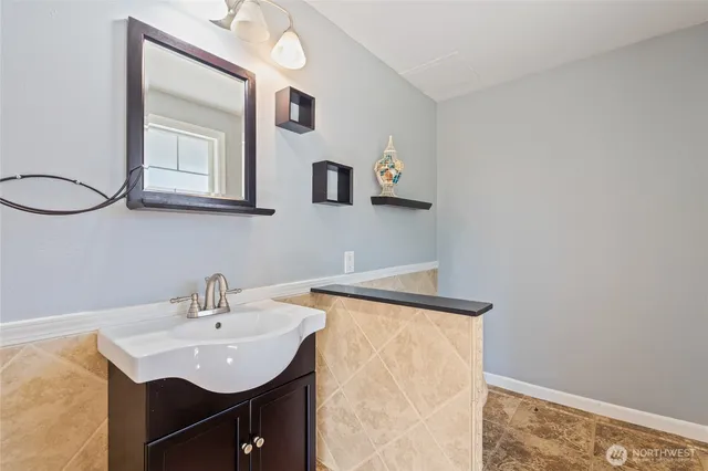 a bathroom with a sink and a mirror
