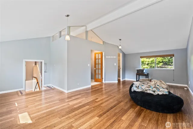 a bed room with a bed and a chair