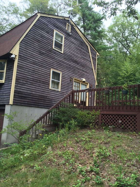 277 Fowler Road Northbridge, MA 01534 - Photo 2 of 14 a backyard of a house with lots of green space
