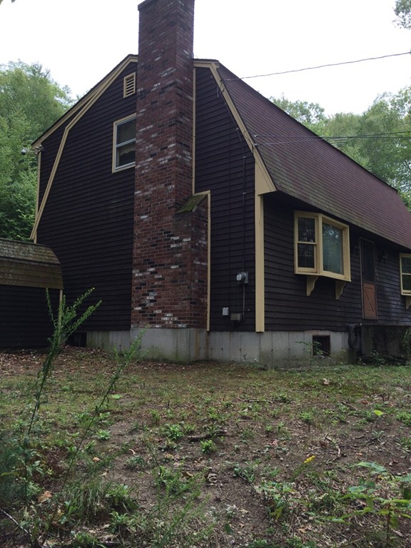 277 Fowler Road Northbridge, MA 01534 - Photo 3 of 14 a brick house with a yard