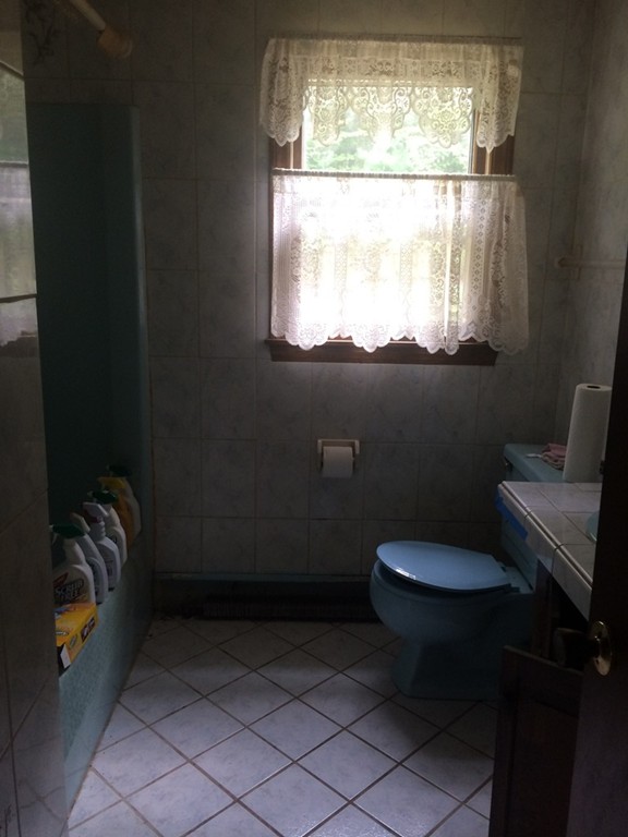 277 Fowler Road Northbridge, MA 01534 - Photo 6 of 14 a bathroom with a toilet a sink and a window