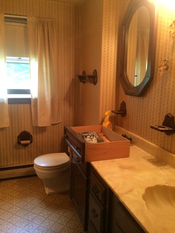 277 Fowler Road Northbridge, MA 01534 - Photo 10 of 14 a bathroom with a sink toilet and a mirror