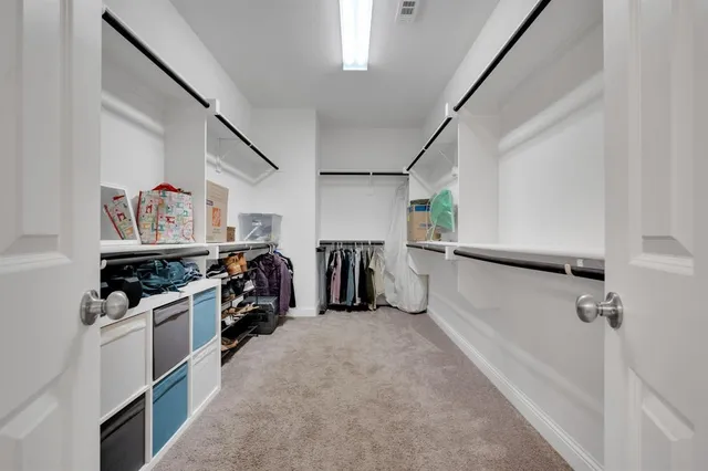 a bathroom with a sink double vanity and a bathtub
