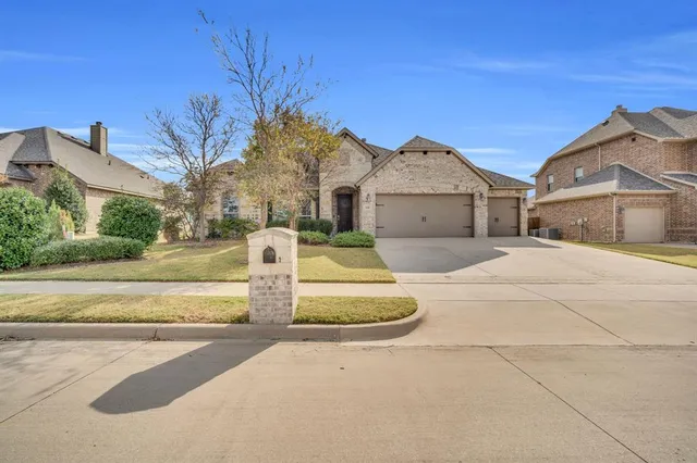 a front view of a house with yard