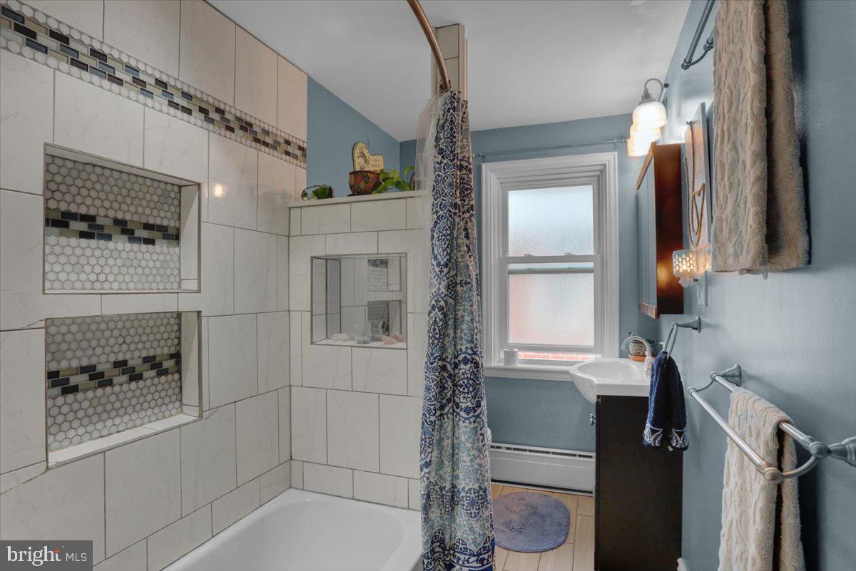 136 West Elm Street Reading, PA 19607 - Photo 13 of 23 a bathroom with a bathtub and a shower