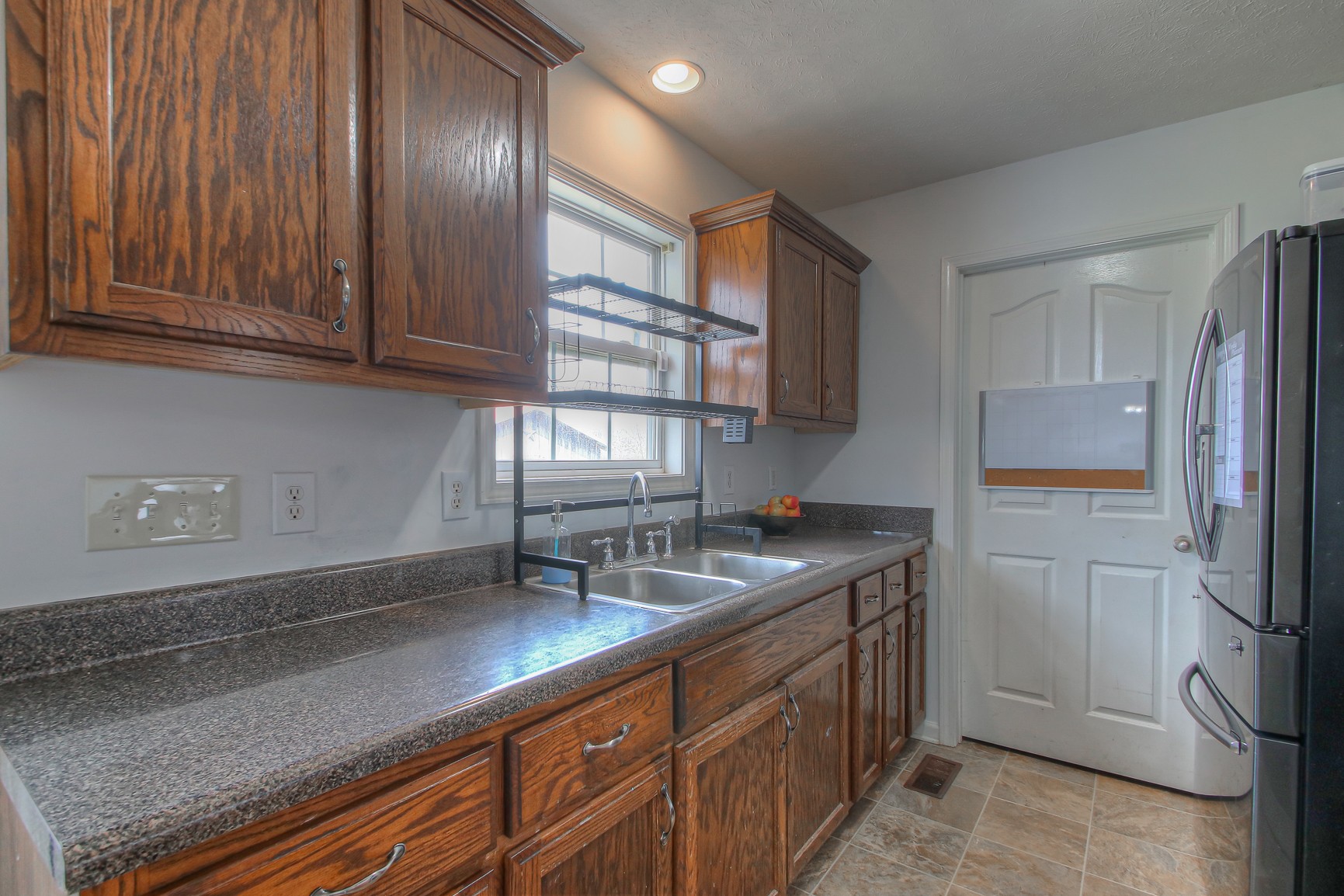 5176 Hugh Woodard Road Springfield, TN 37172 - Photo 3 of 23 a kitchen with stainless steel appliances granite countertop a sink stove and refrigerator
