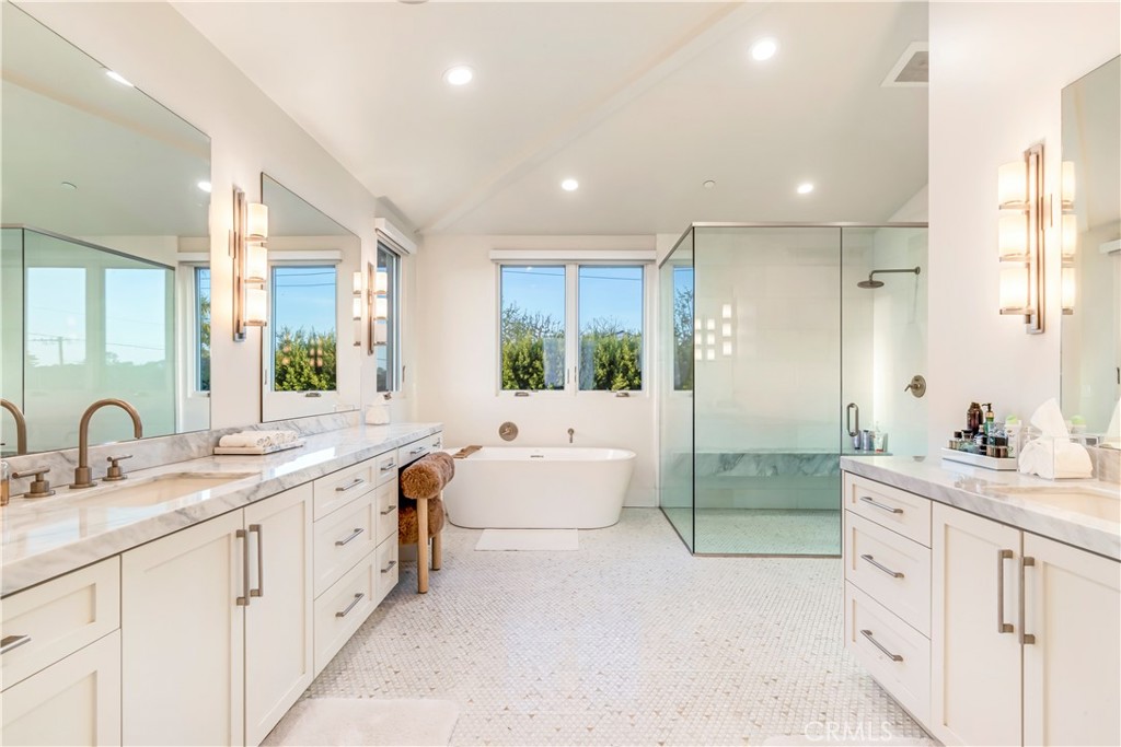 660 Kings Road Newport Beach, CA 92663 - Photo 21 of 41 a spacious bathroom with a double vanity sink a large mirror a bathtub and shower