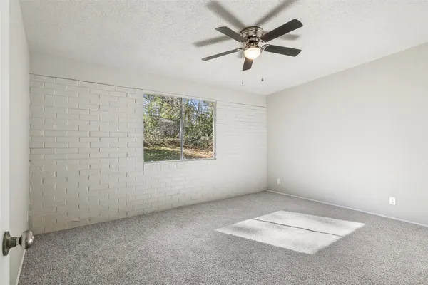 a bedroom with a bed and furniture
