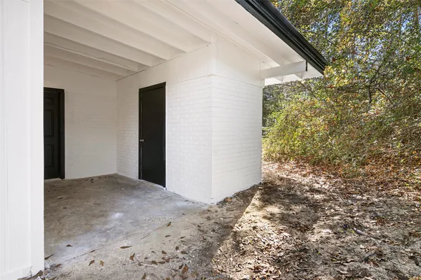 a view of a yard with a tree