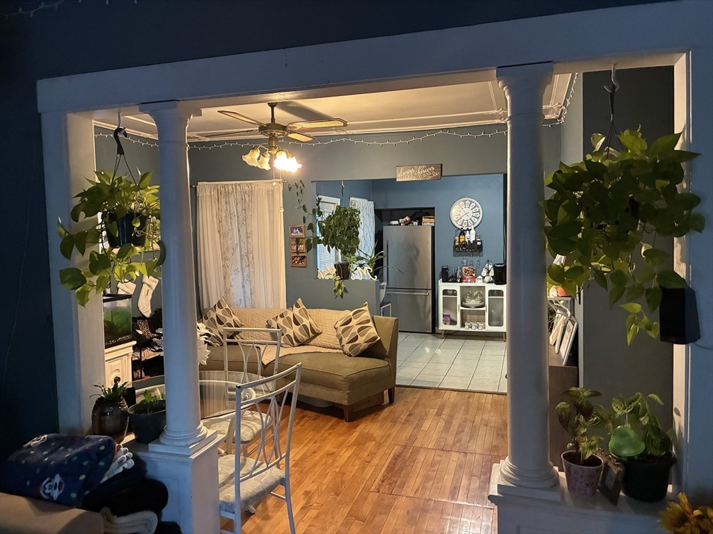 89 Worcester Street Southbridge, MA 01550 - Photo 11 of 18 a living room with furniture and a potted plant