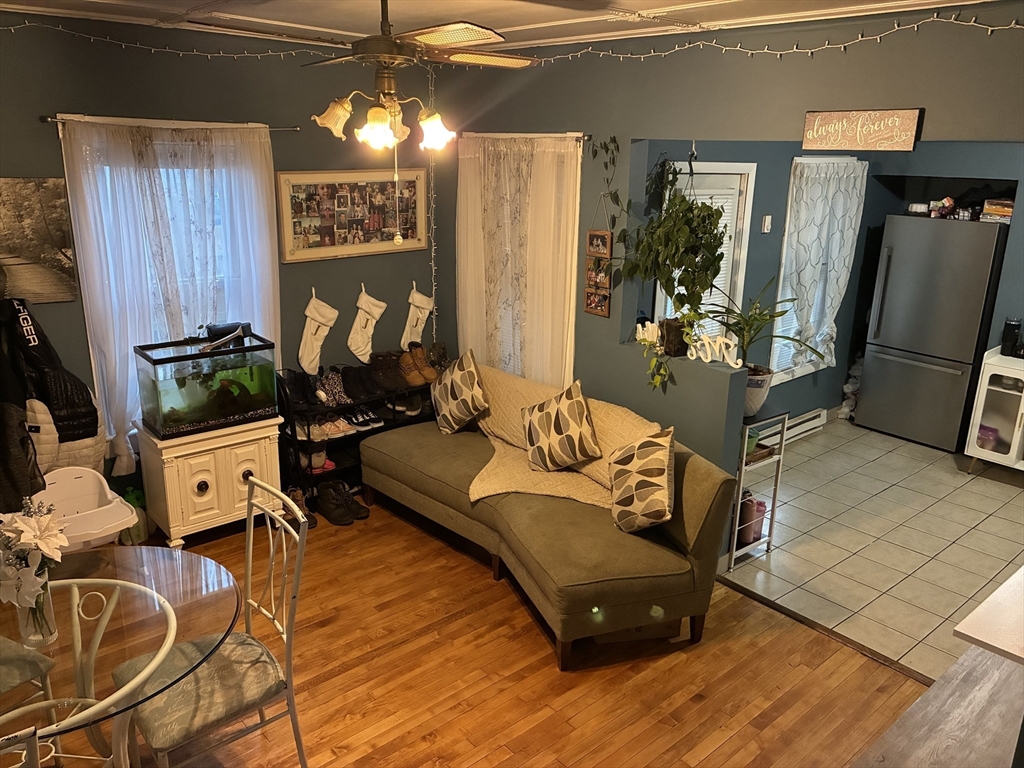 89 Worcester Street Southbridge, MA 01550 - Photo 12 of 18 a living room with furniture window and a flat screen tv