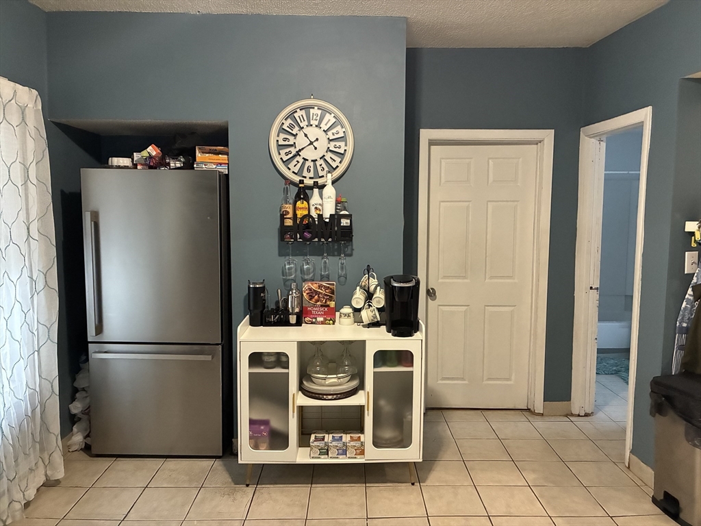 89 Worcester Street Southbridge, MA 01550 - Photo 9 of 18 a kitchen with a refrigerator and a stove top oven