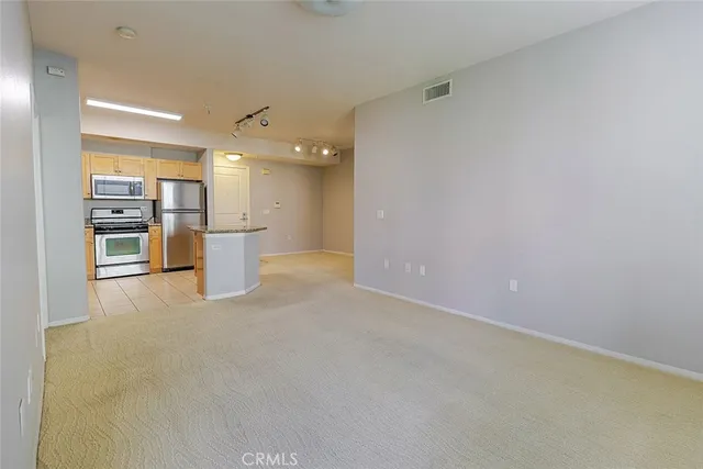 a kitchen with a sink stove and refrigerator