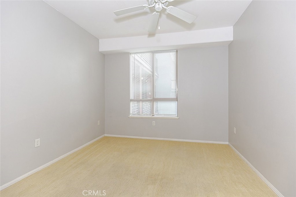 100 South Alameda Street, Unit 353 Los Angeles, CA 90012 - Photo 21 of 60 an empty room with a window and a fan