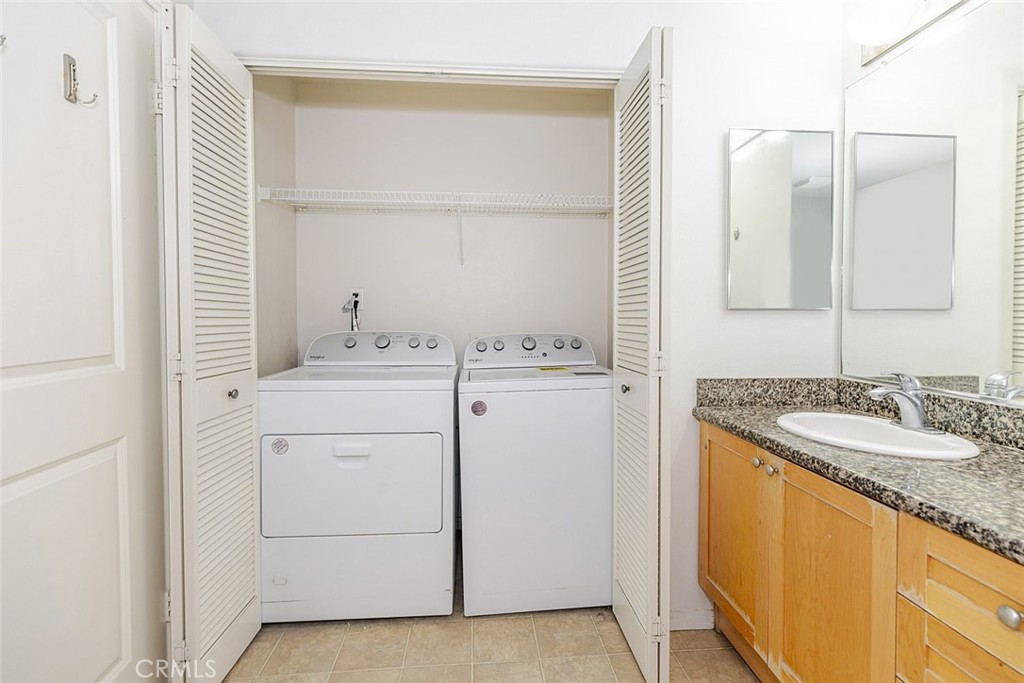 100 South Alameda Street, Unit 353 Los Angeles, CA 90012 - Photo 23 of 60 a bathroom with a sink and a mirror