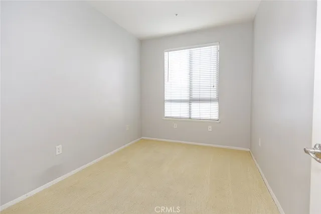 a view of a street with a building in the background