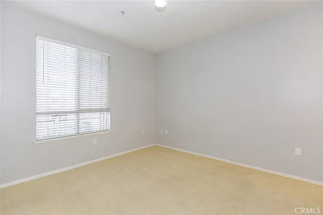 a view of a patio with couches and potted plants