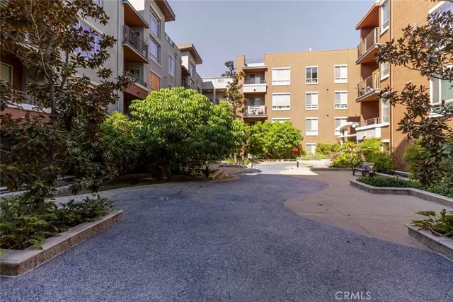 a view of a patio with couches and potted plants