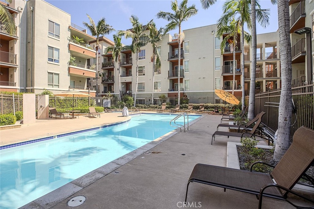 100 South Alameda Street, Unit 353 Los Angeles, CA 90012 - Photo 34 of 60 a view of a swimming pool with chairs