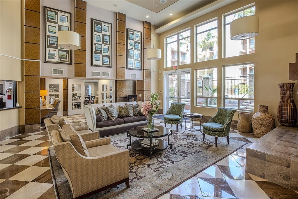 100 South Alameda Street, Unit 353 Los Angeles, CA 90012 - Photo 39 of 60 a living room with furniture and large windows