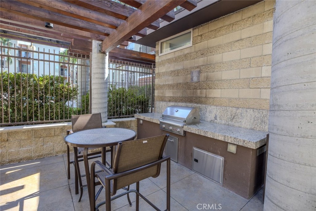 100 South Alameda Street, Unit 353 Los Angeles, CA 90012 - Photo 43 of 60 a table and chairs in a patio