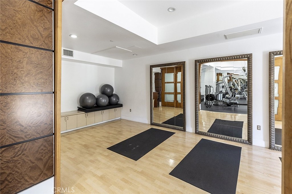 100 South Alameda Street, Unit 353 Los Angeles, CA 90012 - Photo 46 of 60 a room with a large mirror and glass door