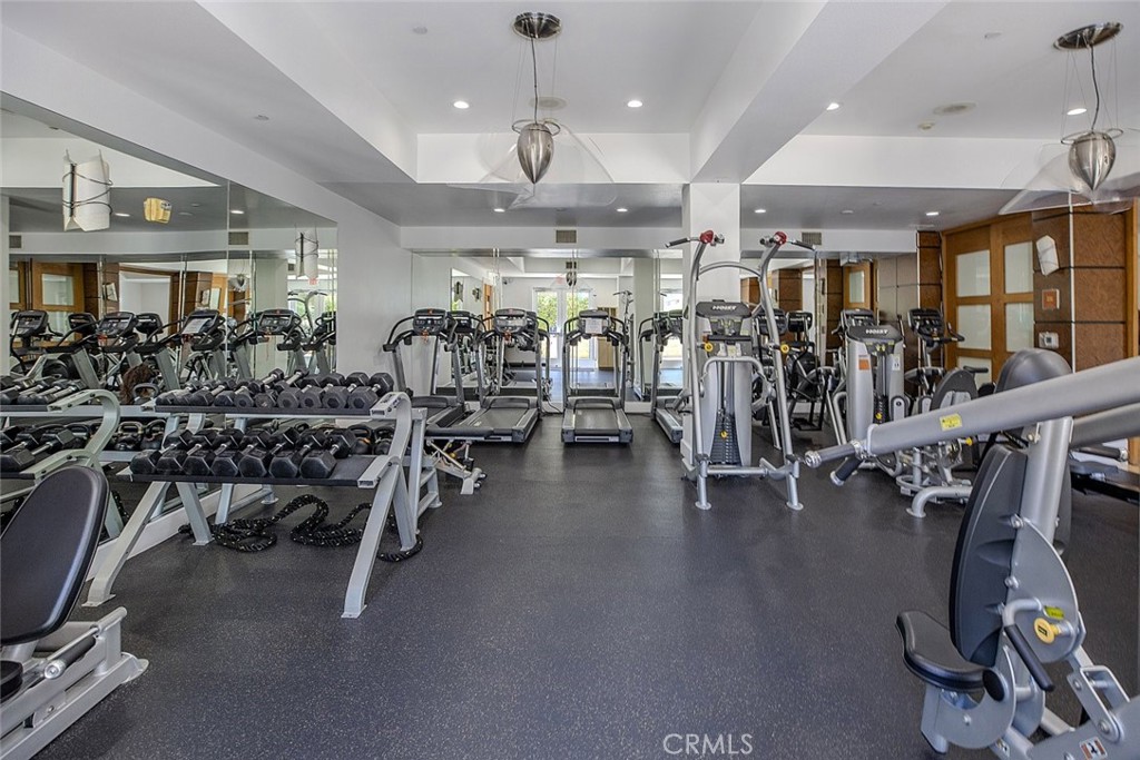 100 South Alameda Street, Unit 353 Los Angeles, CA 90012 - Photo 49 of 60 a view of a room with gym equipment