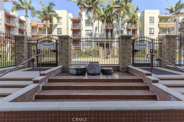 a living room with fireplace furniture and a large window