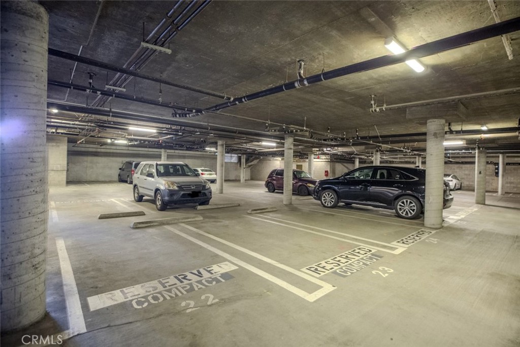 100 South Alameda Street, Unit 353 Los Angeles, CA 90012 - Photo 58 of 60 a view of parking garage with cars parked
