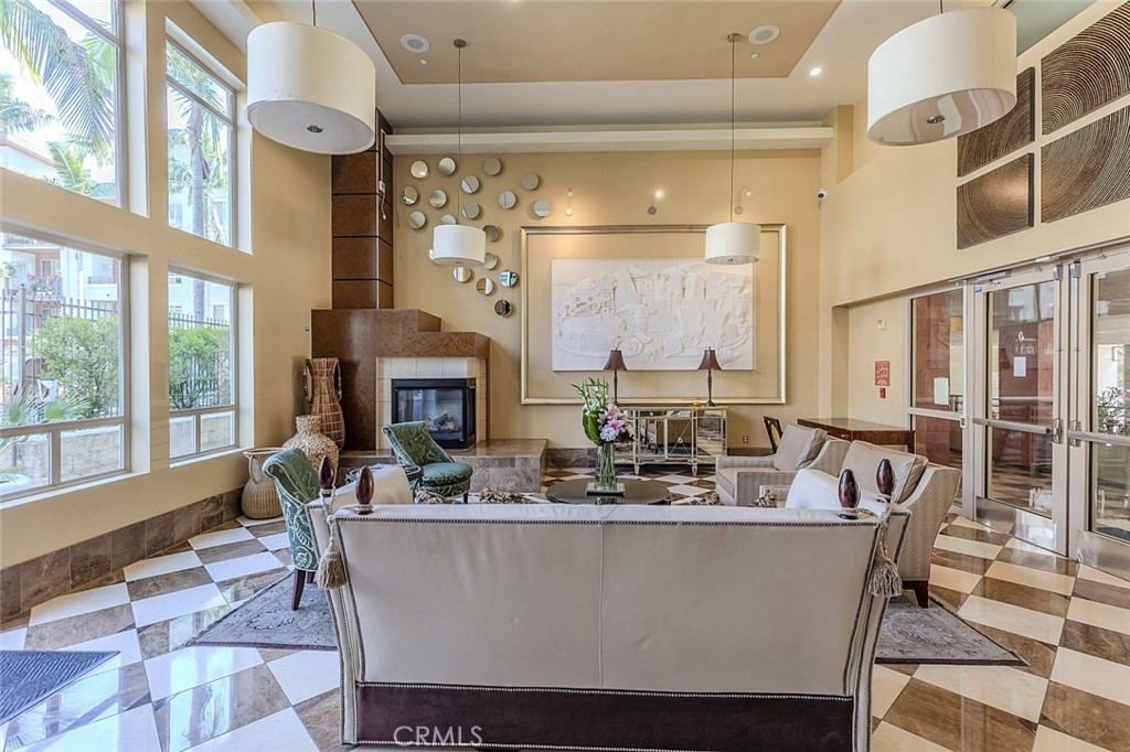 100 South Alameda Street, Unit 353 Los Angeles, CA 90012 - Photo 6 of 60 a living room with fireplace furniture and a large window