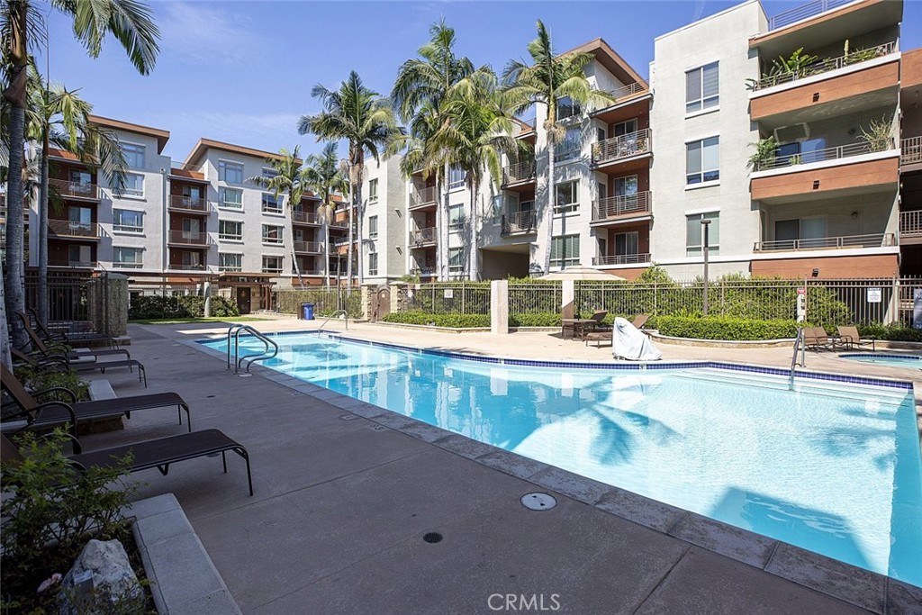 100 South Alameda Street, Unit 353 Los Angeles, CA 90012 - Photo 7 of 60 a view of a swimming pool with outdoor seating