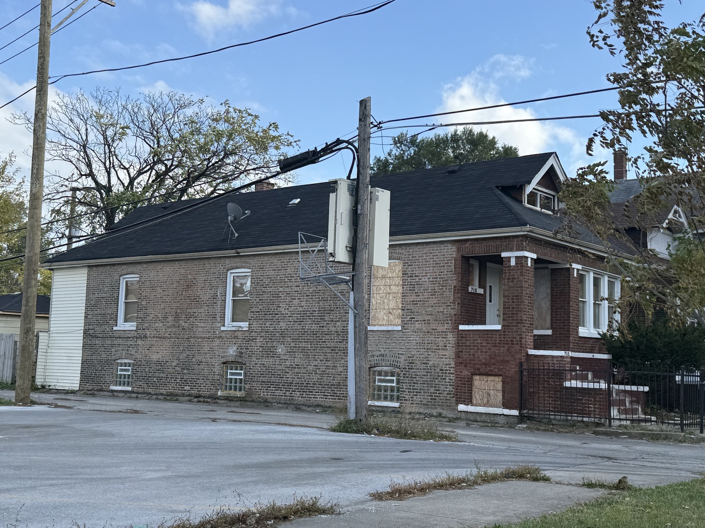 7115 South Peoria Street Chicago, IL 60621 - Photo 19 of 19 a front view of a house with a yard