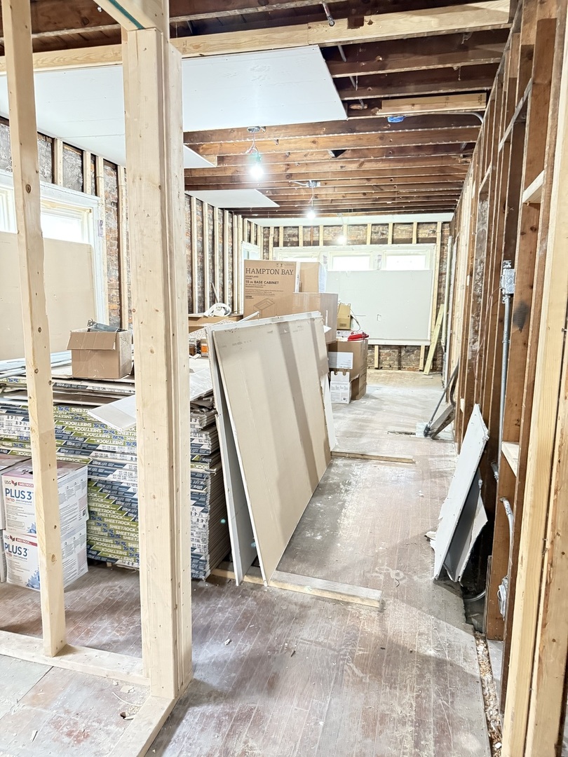 7115 South Peoria Street Chicago, IL 60621 - Photo 7 of 19 a view of a living room with a fireplace and a large window