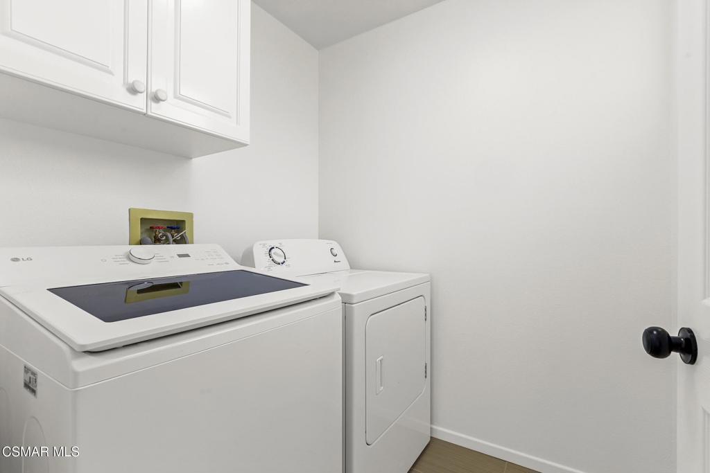495 Novara Way Oak Park, CA 91377 - Photo 20 of 22 a utility room with dryer and washer