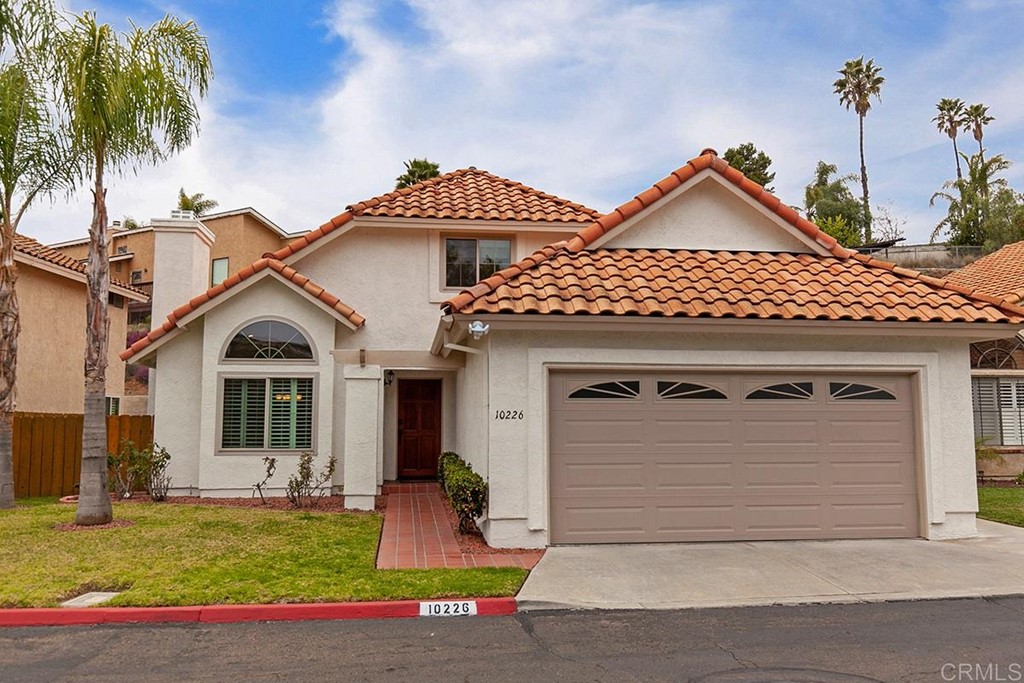 10226 Rock Point Way Spring Valley, CA 91977 - Photo 1 of 1 a front view of a house with a yard