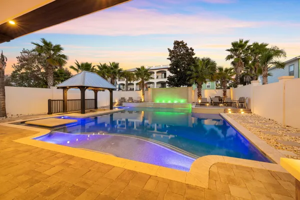 a view of swimming pool with outdoor seating