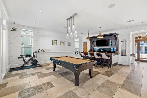 a living room with furniture a dining table and a piano table