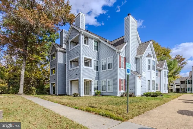 a view of a building with a yard