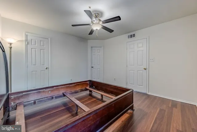 a view of a room with wooden floor