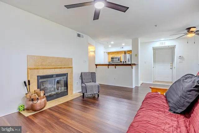 a living room with furniture and a fireplace