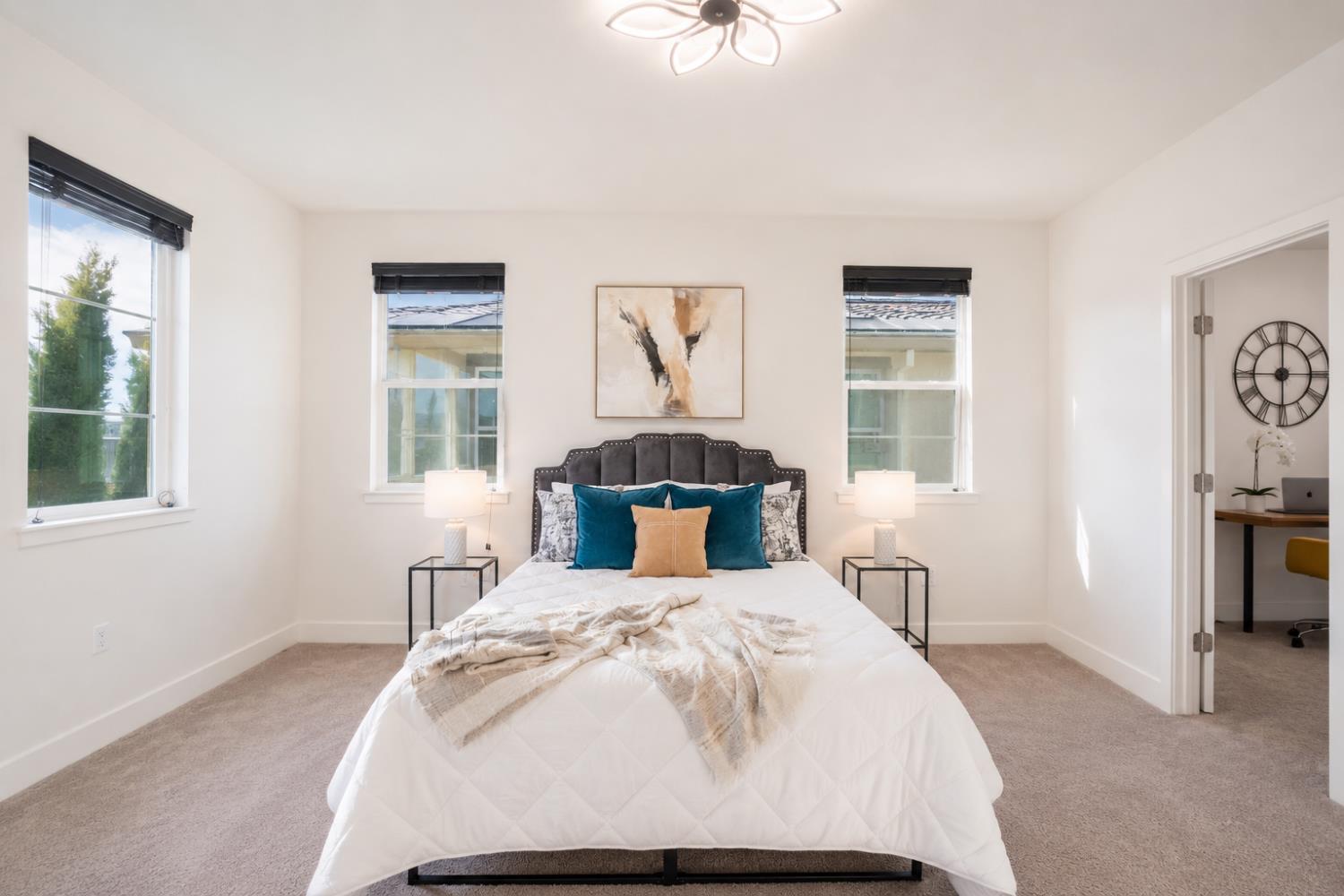 1837 South La Barbera Avenue Mountain House, CA 95391 - Photo 21 of 54 a bed sitting in a bedroom next to a window
