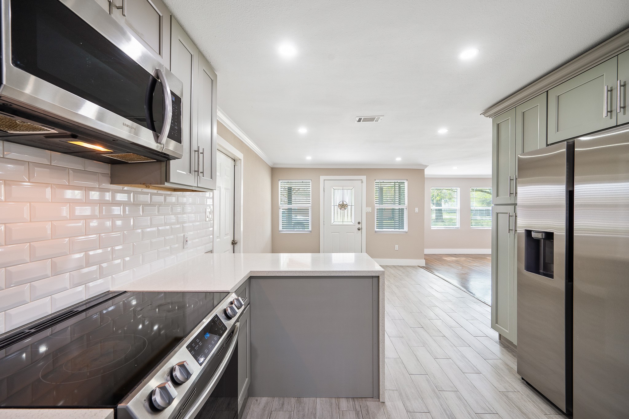 2222 Peppermill Road Houston, TX 77080 - Photo 13 of 38 a kitchen with stainless steel appliances granite countertop a sink a stove and a refrigerator
