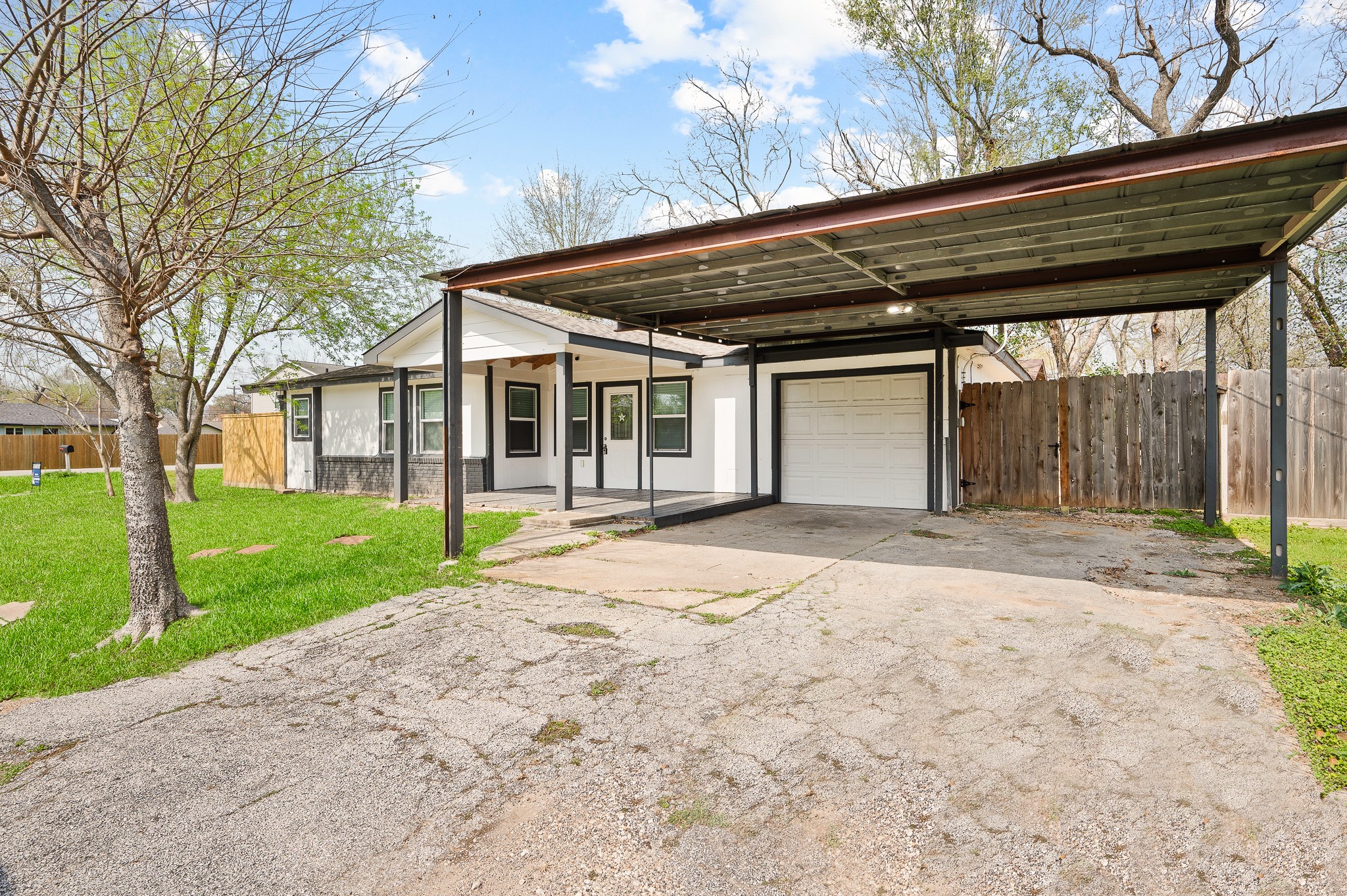 2222 Peppermill Road Houston, TX 77080 - Photo 2 of 38 a yellow house with trees in front of it
