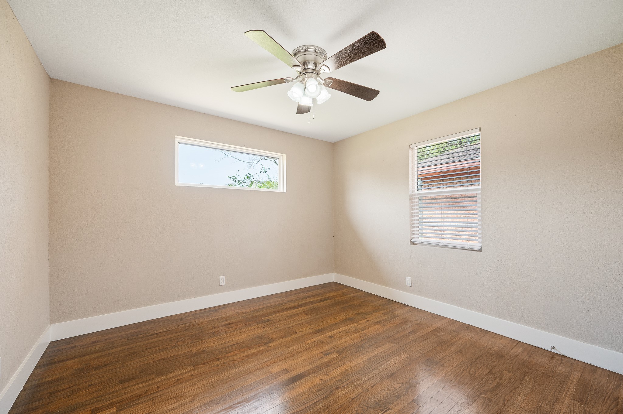2222 Peppermill Road Houston, TX 77080 - Photo 25 of 38 wooden floor in an empty room with a window