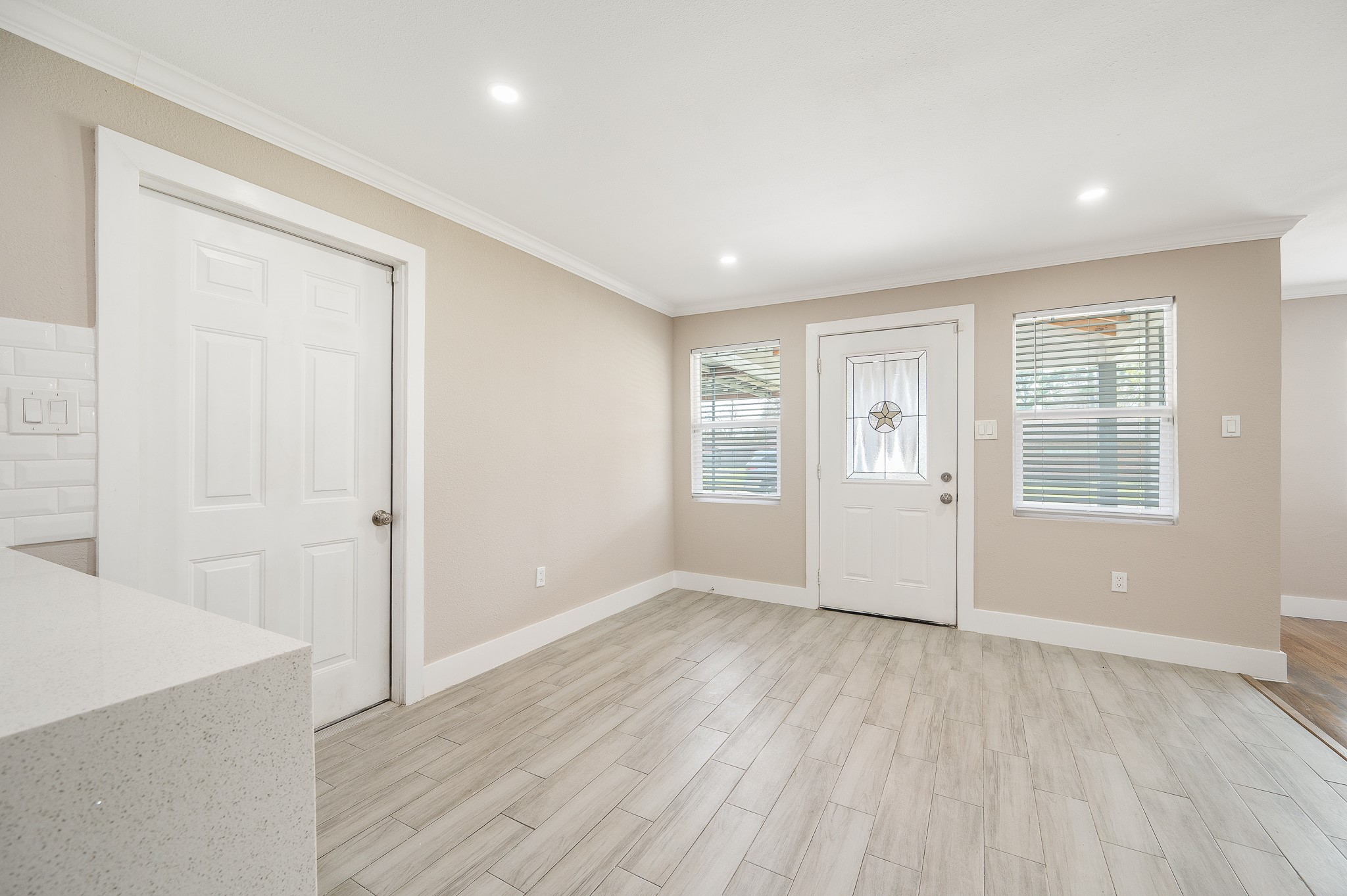 2222 Peppermill Road Houston, TX 77080 - Photo 7 of 38 wooden floor in an empty room with a window