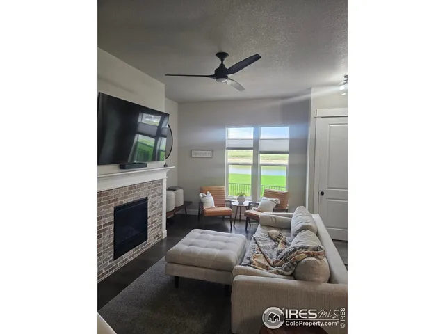 a view of a dining room with a table and chairs